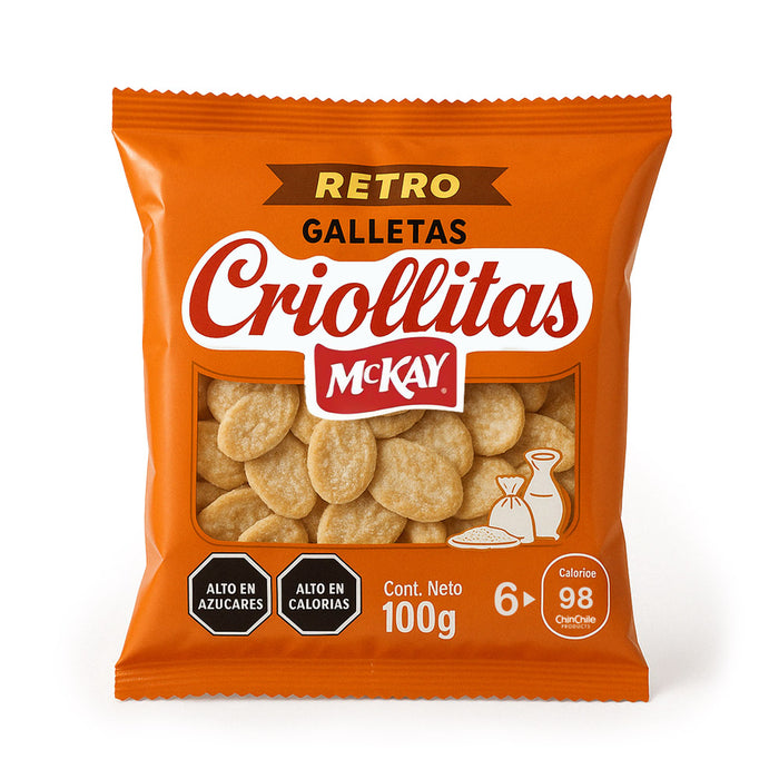 Envase de Criollitas Retro Galletas McKay de 100 g sobre fondo blanco puro, que muestra detalles claros del producto, incluidas advertencias nutricionales y una ventana transparente que revela las galletas recubiertas de azúcar.