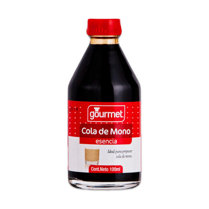 Botella de vidrio transparente de Esencia Cola de Mono con tapón y etiqueta rojos.