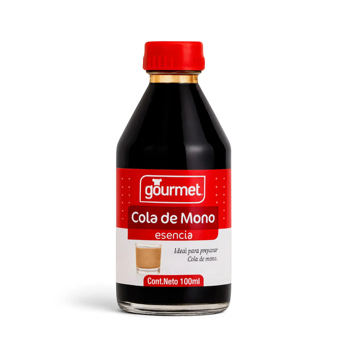 Botella de vidrio transparente de Esencia Cola de Mono con tapón y etiqueta rojos sobre fondo blanco.